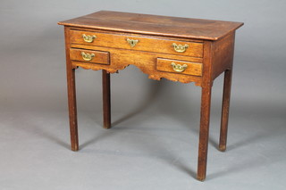 A George II oak low boy fitted an arrangement of 3 drawers  above a shaped apron, raised on square chamfered legs 29"h x  34"w x 18.5"d  ILLUSTRATED