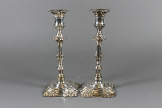 A pair of 19th Century Rococo style silver plated candlesticks with detachable sconces 10"