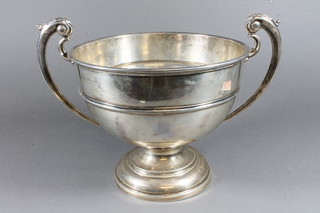 A silver twin handled pedestal bowl raised on a spreading foot, London 1929 22 ozs  ILLUSTRATED