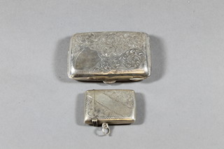 An Edwardian silver vesta case Birmingham 1908 and an  Edwardian silver cigarette case Birmingham 1905 2 ozs