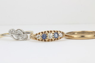 A 9ct gold wedding band, a gold dress ring set sapphires and  diamonds and a 18ct gold dress ring set 3 diamonds