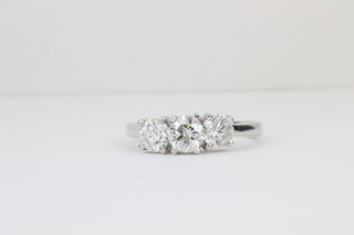 A lady's 18ct white gold dress ring set 3 large diamonds approx  1.75ct