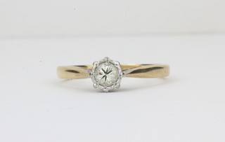 A lady's gold dress ring set a solitaire diamond