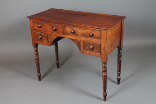 A Victorian mahogany writing table fitted an arrangement of 4 drawers, raised on ring turned tapered legs, peg feet 29"h x 36"w  x 16.5"d