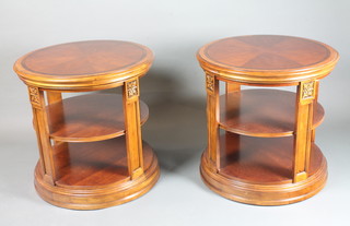 A pair of 18th Century style stained beechwood and mahogany 2  tier occasional tables, crossbanded, the circular moulded tops  having rosette carved pilaster supports, raised on circular plinth  bases, 27.5"h x 28"diam.