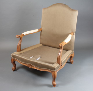 A pair of Louis XV style stained beechwood framed fauteuil  having black and gold striped woven upholstery and loose paisley  cushions, scroll arms, raised on cabriole legs and scroll feet by  Ethan Allen