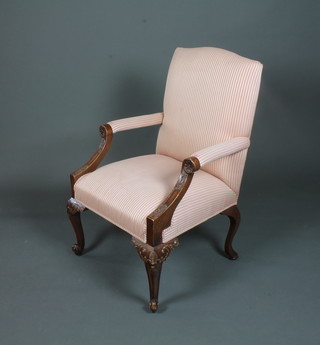 William L Maclean, Brighton, a George III style mahogany open  arm chair, having pink and cream woven striped upholstery,  rosette carved arms and raised on shell carved cabriole legs,  scroll feet
