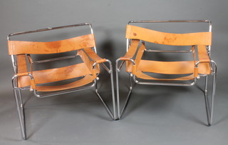 After Marcel Breuer, a pair of Wassily style easy chairs, with tubular chrome steel frames and brown leather strap work   ILLUSTRATED
