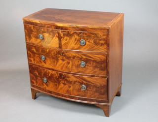 A late George III mahogany bow fronted chest of drawers, satinwood crossbanded and boxwood line inlaid, fitted 2 short  above 2 graduated long drawers on bracket feet 36.5"h x 35" x  20"d