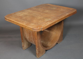 A 1930's Art Deco oak drawleaf extending dining table with concave supports, bears makers label EG, 30"h x 78"w x 36"d  together with 4 matching Art Deco oak dining chairs