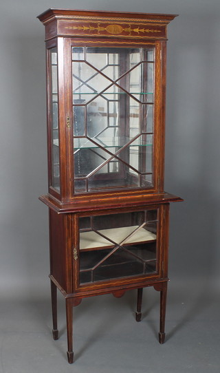An Edwardian Sheraton revival mahogany display cabinet,  boxwood and ebony chequer inlaid, the upper section with moulded cornice above a frieze with hairbell marquetry  decoration over 2 astragal bar glazed doors, raised on square  tapered legs, spade feet 74"h x 28.5"w x 15"d