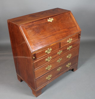 A late George III mahogany bureau, the fall enclosing a fitted interior above 2 short and 3 graduated long drawers, raised on  shaped bracket feet 42"h x 37"w x 21"d
