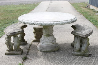 An early 19th Century style reconstituted stone circular garden table, the top with egg and dart edge above an acanthus leaf  moulded column support, socle base 29"h x 50"d, together with 2  concave seated benches with lion rampant supports, plinth bases  39"w x 19"h