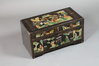 An early 20th Century Japanese black lacquered Tansu, decorated  panels of figures amongst stylised landscapes and fitted 2 small  drawers above 2 cupboard doors, on end supports 13"h x 25"w x  13"d