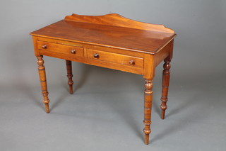 A Victorian mahogany side table fitted 2 frieze drawers, raised on ring turned tapered legs, peg feet 31"h x 42"w x 19"d