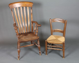 A 19th Century stained beechwood and elm lathe back elbow  chair, together with a childs rush seat chair