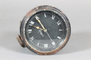 An early 20th Century automobile timepiece by North & Sons  Watford, London, having a black Roman dial with mechanical  cylinder movement 4" diam.
