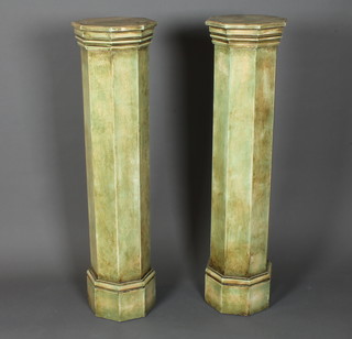 A pair of neo classical style octagonal pedestals having moulded tops raised on plinth bases 47.5"h x 12"w