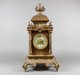 A late 19th Century German gilt brass tower clock, with foliate pierced decoration having Arabic enamelled dial set 8 day  cylinder movement chiming gong, 20.5"h x 11"w x 10.5"d