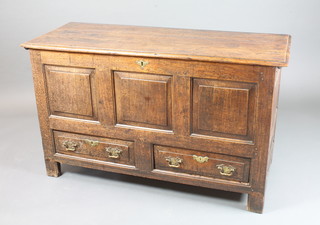 An early 18th Century oak mule chest of panelled construction with hinged top above 2 short drawers, raised on end stiles  30.5"h x 51"w x 20.5"d