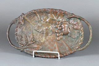 Jan Van Neste, an oval bronze twin handled dish in the form of a  basket cast grapes 30"