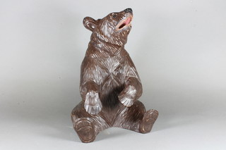 A Swiss carved wooden trinket box in the form of a seated bear  16"