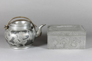A Japanese black glazed terracotta and pewter mounted teapot decorated a dragon and a rectangular engraved pewter jar and  cover decorated a dragon 6"