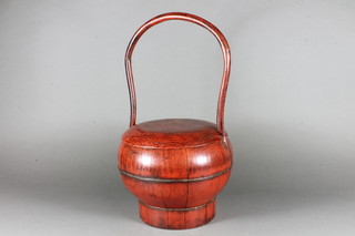 A circular Chinese red lacquered food carrier 18"