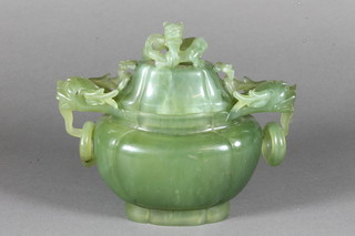 A Chinese carved green jade Koro and cover of quatrefoil form,  the cover mounted Shi Shi above a pair of dragon handles  mounted with rings on a shaped spreading base, 6"h x 7"w x  3.25"d  ILLUSTRATED, FRONT COVER
