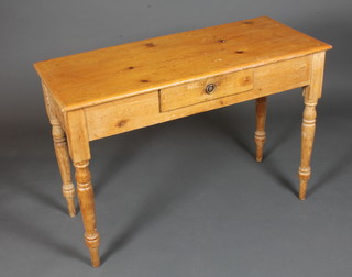 A 19th Century French pine side table fitted single frieze drawer, raised on turned tapered legs 29"h x 42"w x 18"d