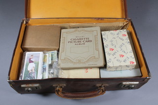 An attache case of various cigarette cards