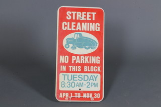 A rectangular enamelled sign "Street Cleaning, No Parking On  This Block Tuesday 8.30am - 2pm" 24" x 12"
