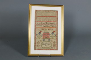 A Victorian wool work sampler with alphabet, numerals, house  and garden by Charlotte Evans, aged 10, 1838, 20" x 11.5"