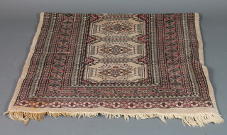 A contemporary grey ground Bokhara rug with 6 stylised  octagons to the centre 62" x 37"