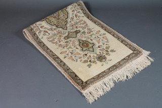 A white ground and floral patterned Persian runner 70" x 25"