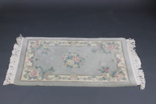 A blue ground and floral patterned Chinese rug 48" x 27"
