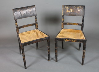 A pair of Regency black lacquered occasional chairs decorated chinoiserie scenes of figures amongst stylised landscape, with  tablet backs, cane seats, raised on ring turned tapered legs