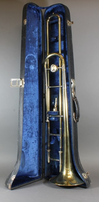 A brass and chrome trombone by B & M Champion, cased