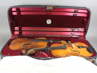 A 19th Century violin by Hopf with 2 piece back together with 1  other violin and a bow, both contained in a fibre carrying case