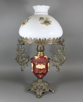 A Continental pottery oil lamp reservoir contained in a gilt metal  mount with opaque glass shade, no chimney,