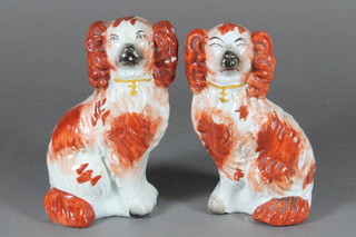 A pair of Staffordshire seated brown and white Spaniels 3"