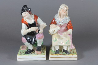 A pair of Staffordshire figures of cobbler and lady 7"
