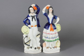 A pair of 19th Century Staffordshire figures of standing sailor  and lady 10"