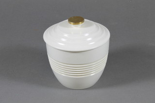 A Keith Murray circular Wedgwood Art Deco jar and cover 3",  slight chips to base and rubbing to the gilt finial