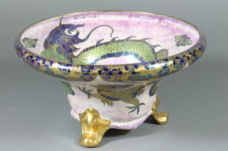 A Malingware circular bowl decorated a dragon raised on 3 feet  9"