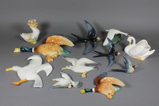 A Sylvac flight of 3 pottery figures of blue birds together with a collection of other pottery figures of birds