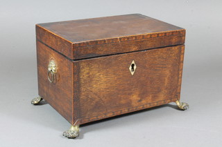 A late George III lace wood and parquetry 2 division tea caddy,  the hinged top enclosing 2 covered divisions flanked by lion mask  handles, raised on claw feet 6"h x 9"w x 7"d