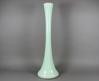A turquoise waisted glass vase 24"