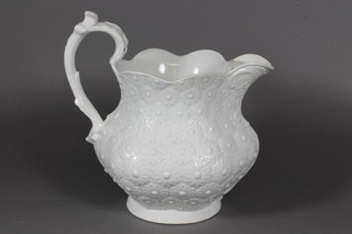 A Victorian white glazed and floral patterned jug 7"