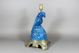 A blue glazed pottery table lamp in the form of a bird on rocky outcrop 14"